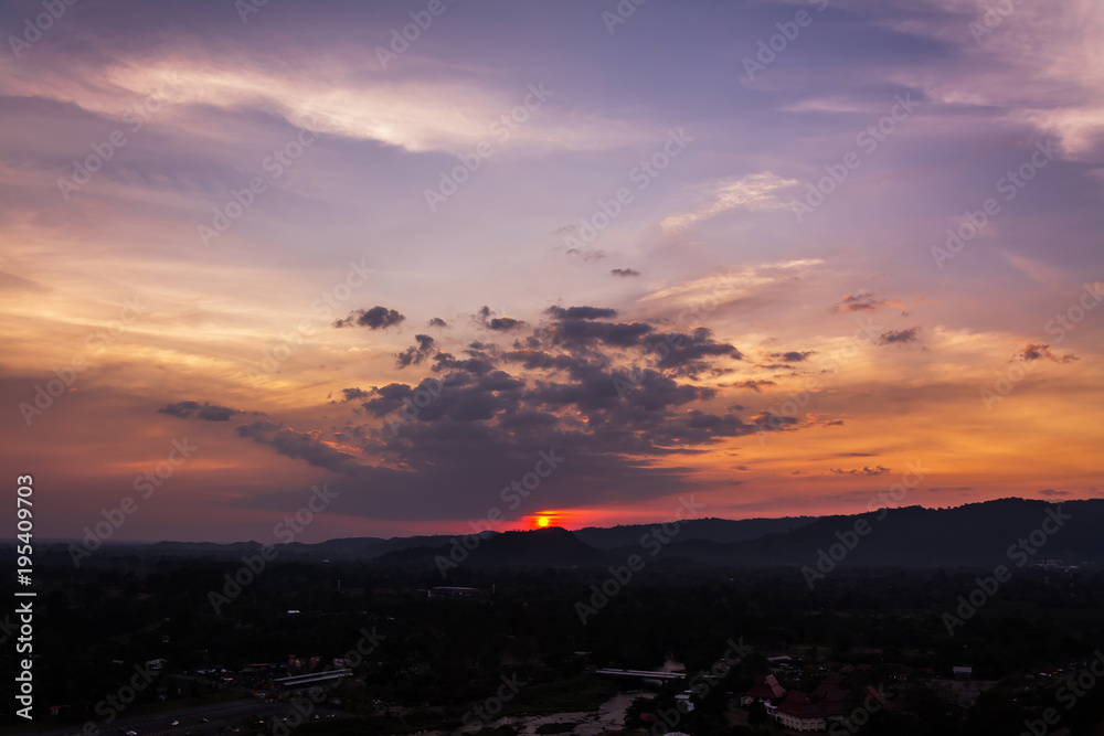 sunset over mountains or hills