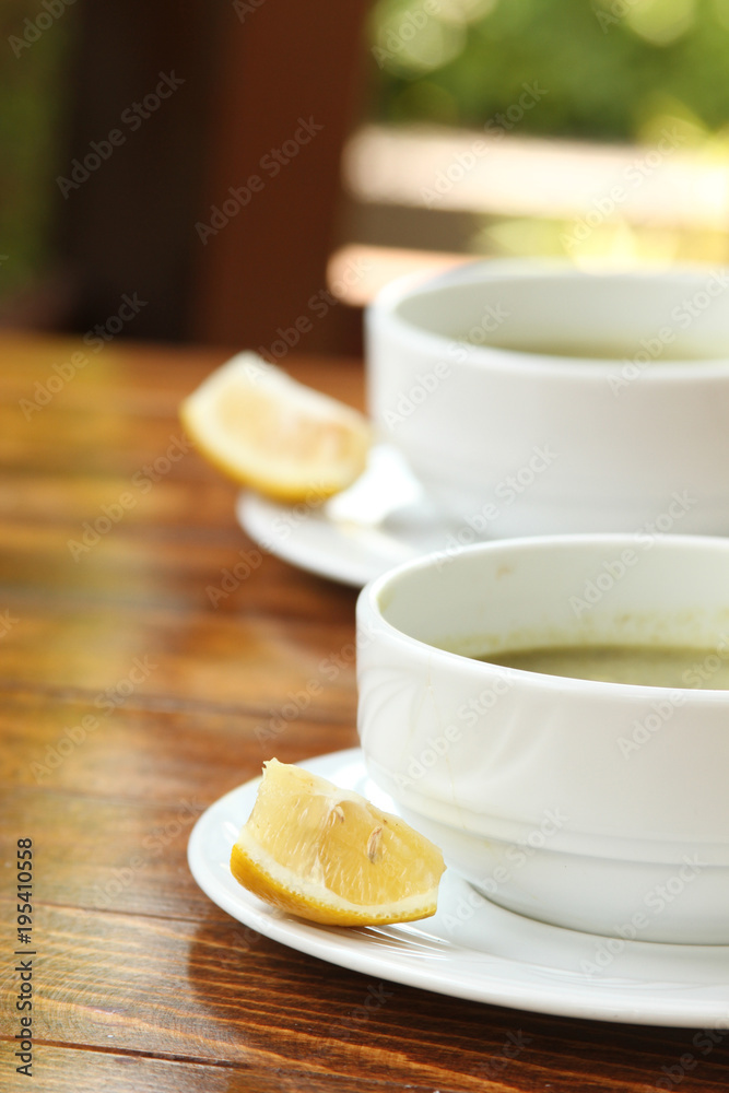 Two plates of hot soup on a summer terrace Two plates of hot soup on a summer terrace