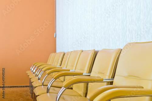 Row of empty chairs in the conference room photo