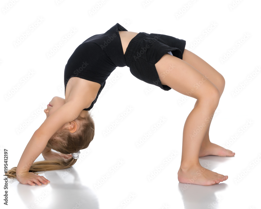 Fototapeta premium The gymnast perform an acrobatic element on the floor.
