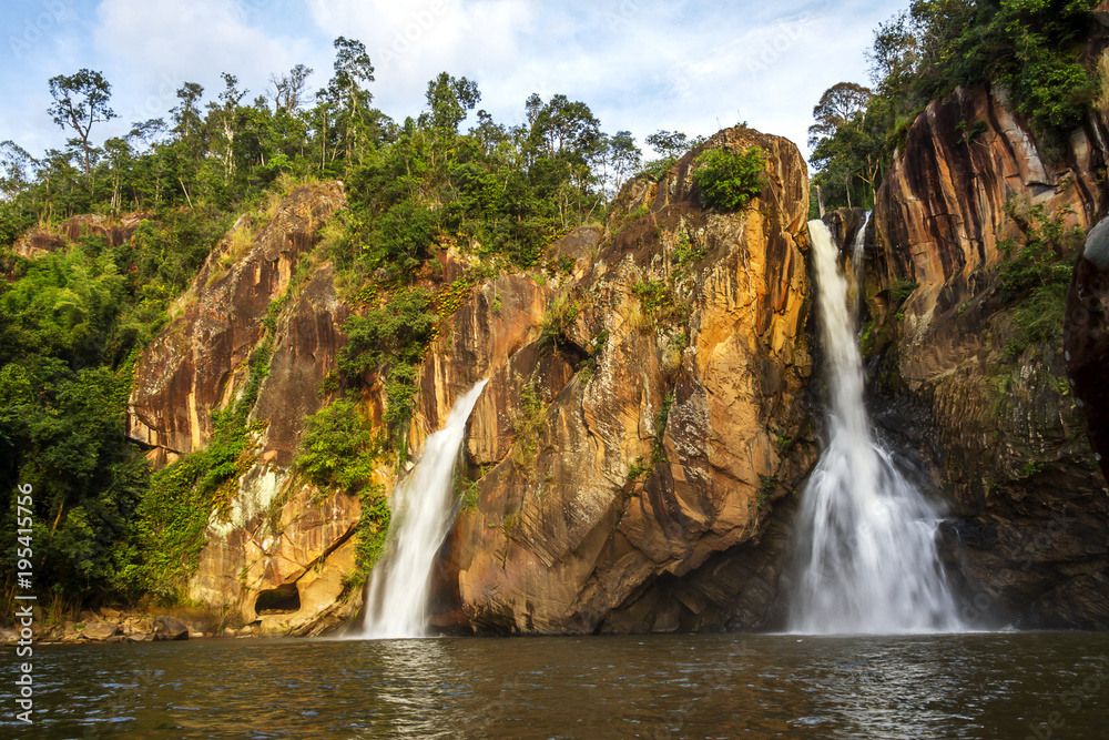 Waterfall and cliff beautiful with sunshine Waterfall and cliff beautiful with sunshine