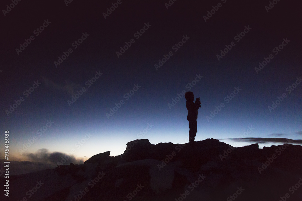 Silhouette of a climber in the French Alps at the sunset, France