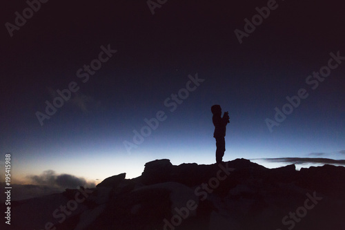 Silhouette of a climber in the French Alps at the sunset, France