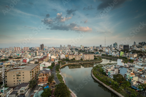 HO CHI MINH, VIETNAM - NOV 20, 2017: Royalty high quality stock image aerial view of Ho Chi Minh city, Vietnam. Beauty skyscrapers along river light smooth down urban development in Ho Chi Minh City © binhho image