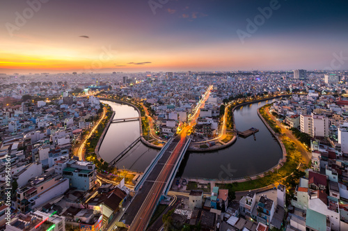 HO CHI MINH, VIETNAM - NOV 20, 2017: Royalty high quality stock image aerial view of Ho Chi Minh city, Vietnam. Beauty skyscrapers along river light smooth down urban development in Ho Chi Minh City photo