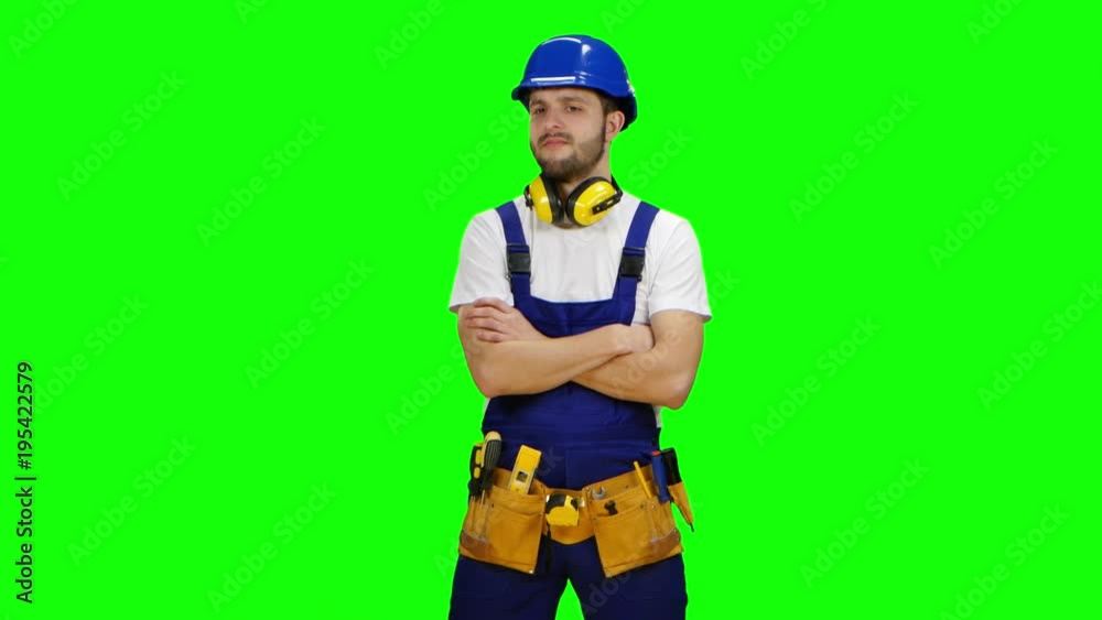 Builder is thinking how to properly draw a sketch for building a building. Green screen