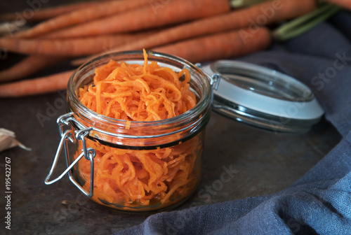 Healthy organic carrot salad in jar. photo