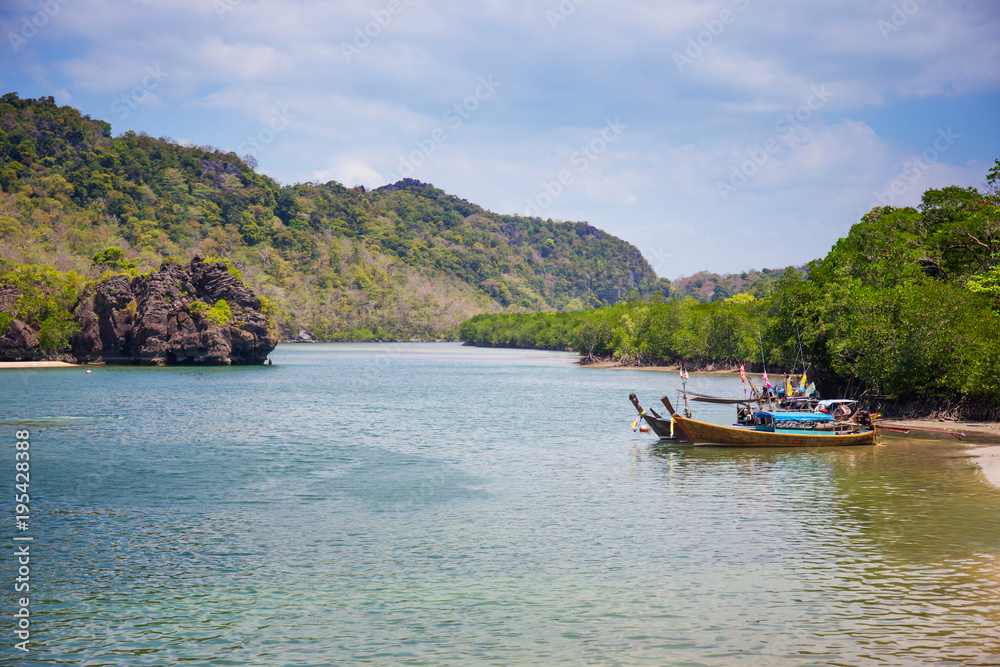 Summer beach with clearly sea and blue sky at Tarutao national park Satun, Thailand. Using for summer background 