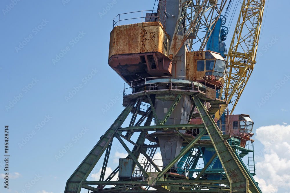 Heavy harbour jib cranes in the Kaliningrad Sea Fishing Port. Heavy harbour jib cranes in the Kaliningrad Sea Fishing Port.