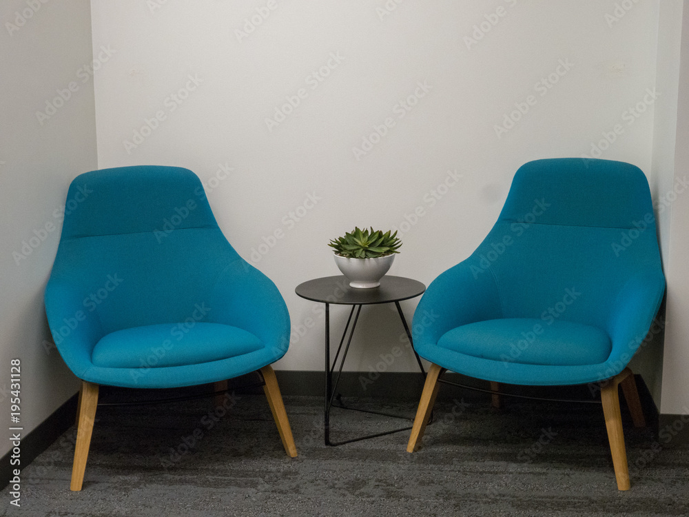 Obraz premium Two chairs in corner nook of office
