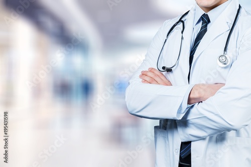 Young man doctor holding stethoscope