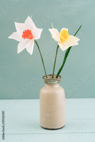 Bouquet of crepe paper daffodil flowers in a vase