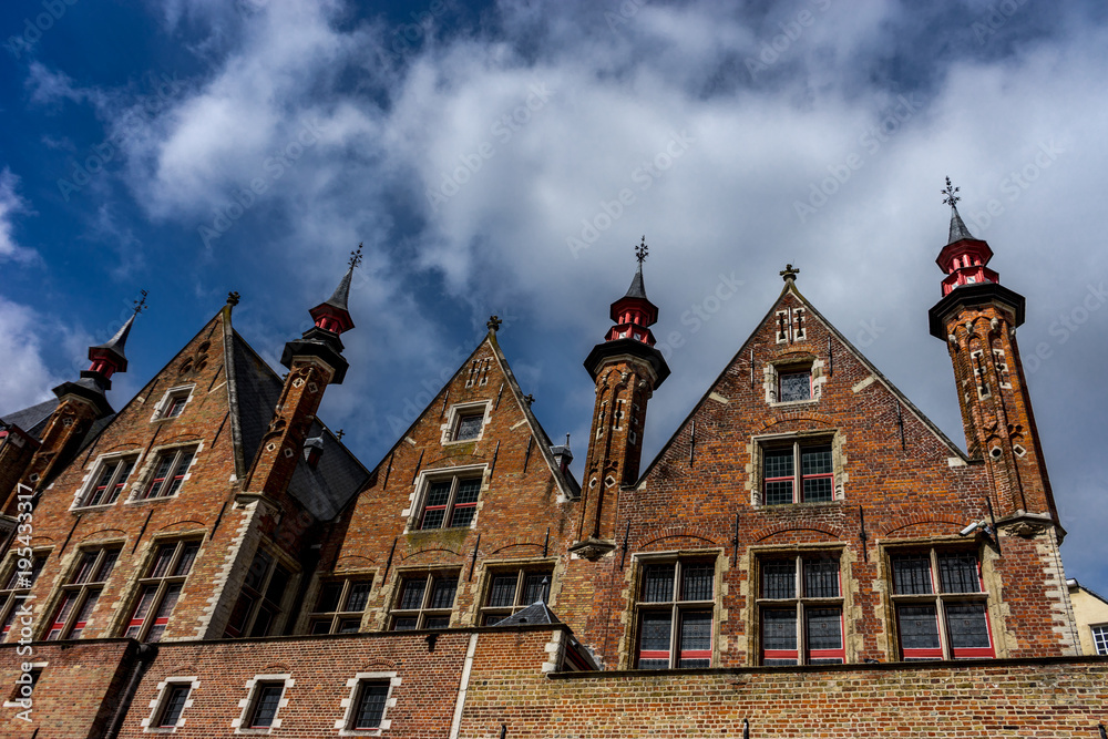 Rooftop with cross and spire on the houses at Brugge, Belgium, Europe Rooftop with cross and spire on the houses at Brugge, Belgium, Europe