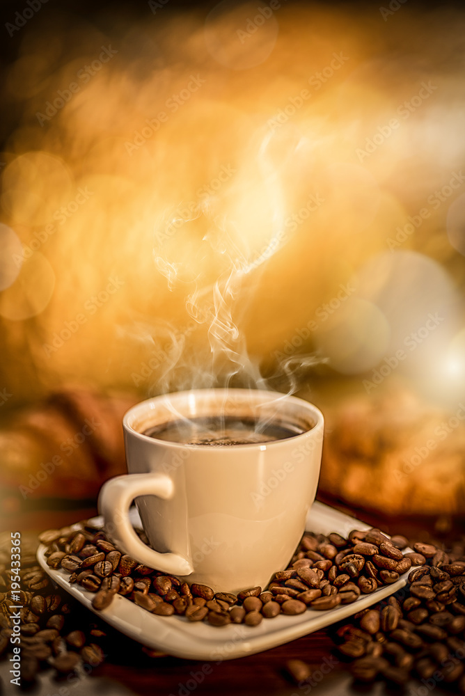 fresh hot coffee laid on the table, roasted coffee beans fried like a decoration on a wooden table, blurred background