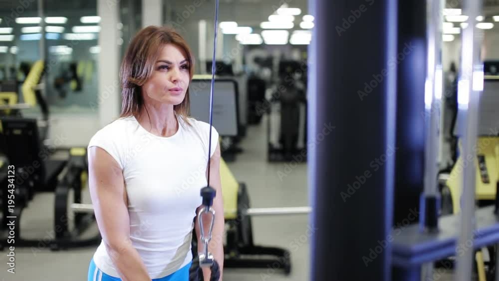 sexy woman doing exercise in gym sexy woman doing exercise in gym