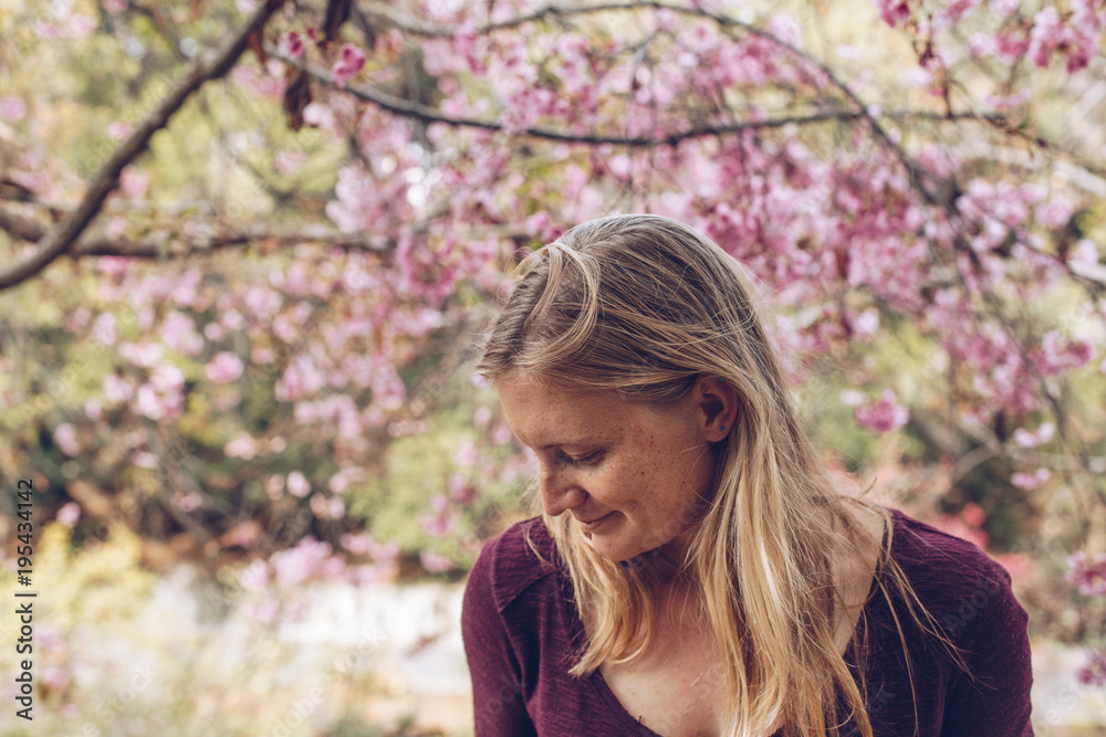 Blonde Woman Portrait with Cherry Blossoms Blonde Woman Portrait with Cherry Blossoms