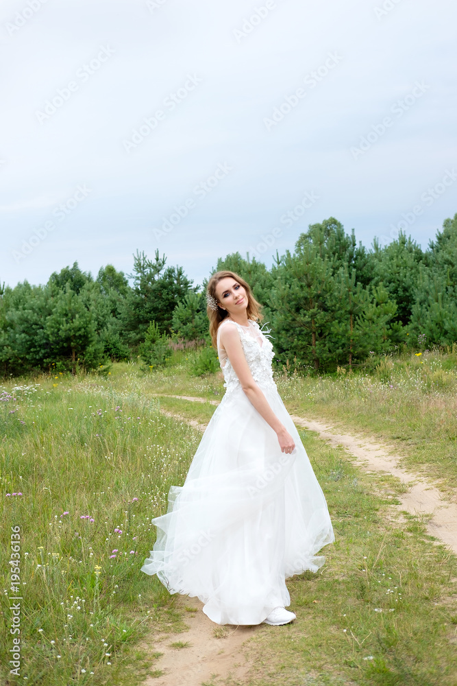 young pretty bride in white wedding dress outdoors, make up and hairstyle young pretty bride in white wedding dress outdoors, make up and hairstyle