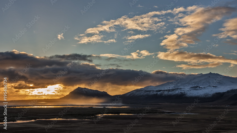 Mist Rises over the Bay as the Autumn Sun Sets Over the Icelandic Volcano Snaefellsjokull