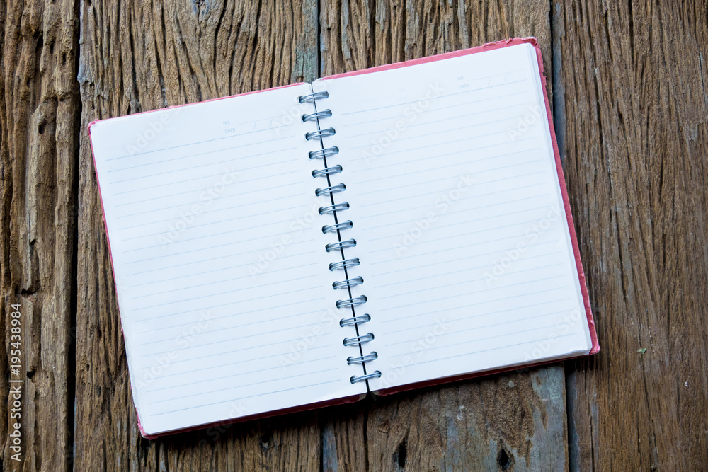 Top view of notebok with pencil on wooden table. Emtry page for text. Top view of notebok with pencil on wooden table. Emtry page for text.