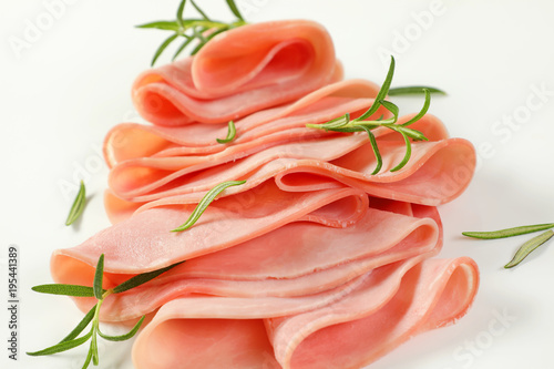 thin slices of ham with rosemary