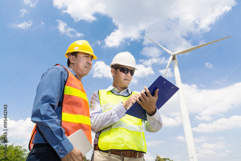 Engineer and Architect working at Wind Turbine Power Generator Engineer and Architect working at Wind Turbine Power Generator