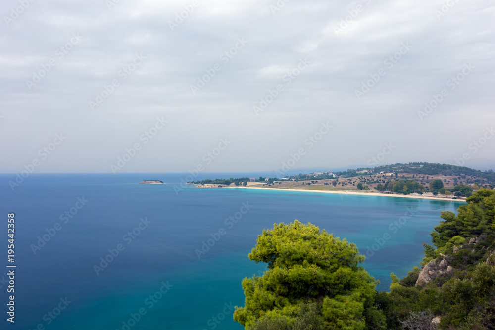 Gorgeous scenery by the sea under a cloudy sky in Sithonia, Chalkidiki, Greece 
