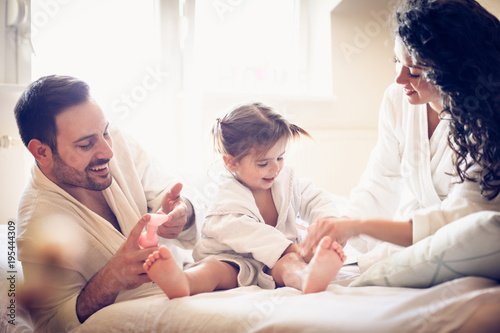 Care after bath is important. Happy parents.