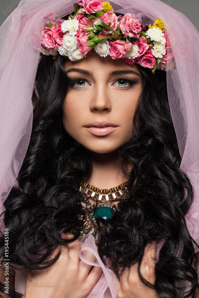 Beautiful Female Face with Flowers. Closeup Fashion Beauty Portrait