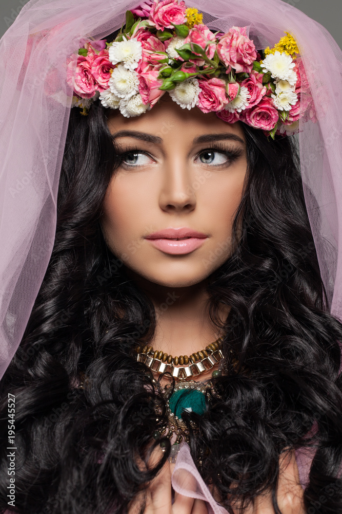 Brunette Woman with Makeup and Flowers Hairstyle. Female Face Close up