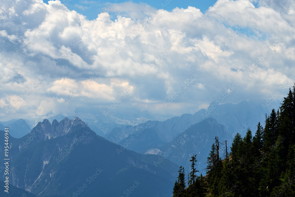 The famous mountain top Raibler Fünfspitz under a wild sky, seen from Dobratsch Nature Park