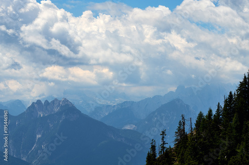 The famous mountain top Raibler Fünfspitz under a wild sky, seen from Dobratsch Nature Park