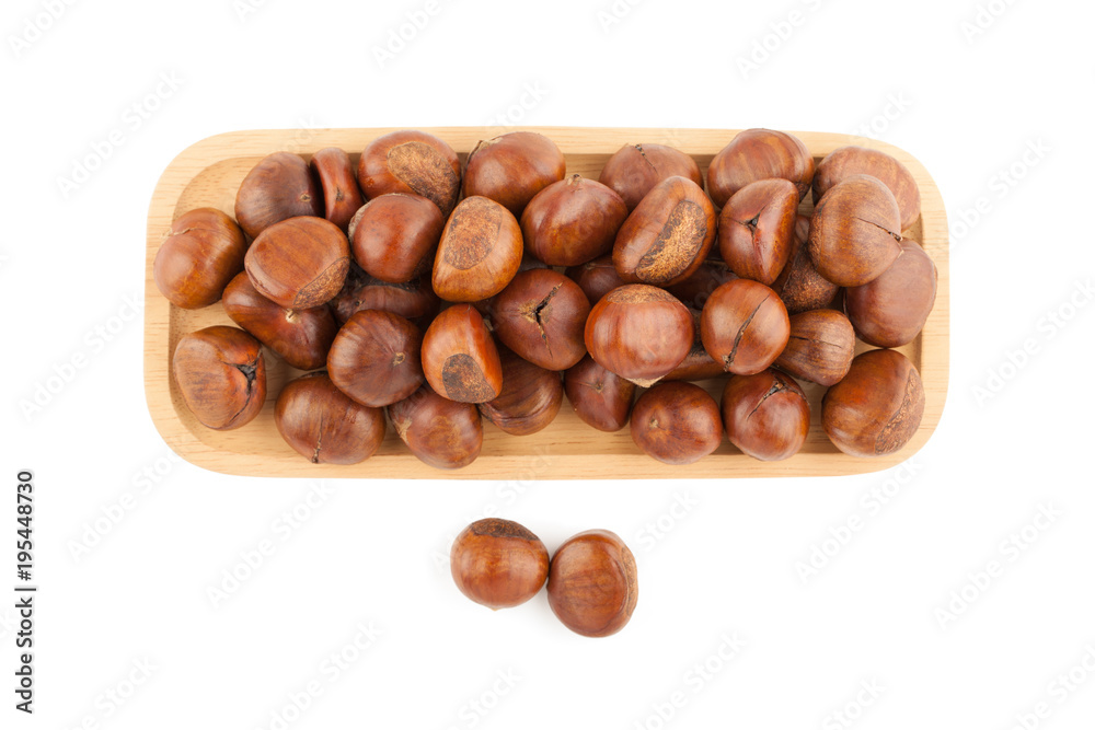 Top view angle of chestnut in wooden plate Top view angle of chestnut in wooden plate