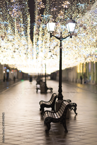 The city street. benches and street lights. Illumination photo