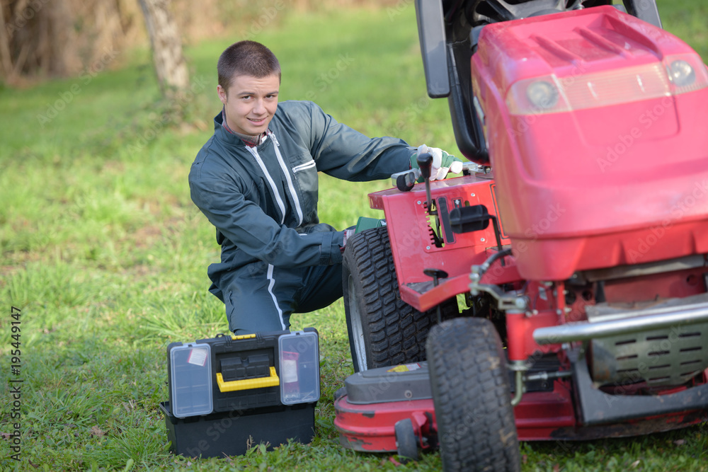 Fototapeta premium gardener tractor driver fixing something