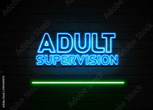 Adult Supervision neon sign mounted on brick wall.