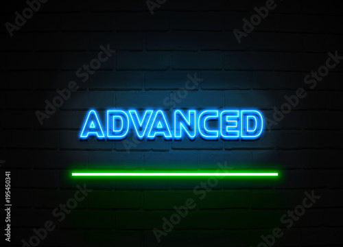 Advanced neon sign mounted on brick wall.