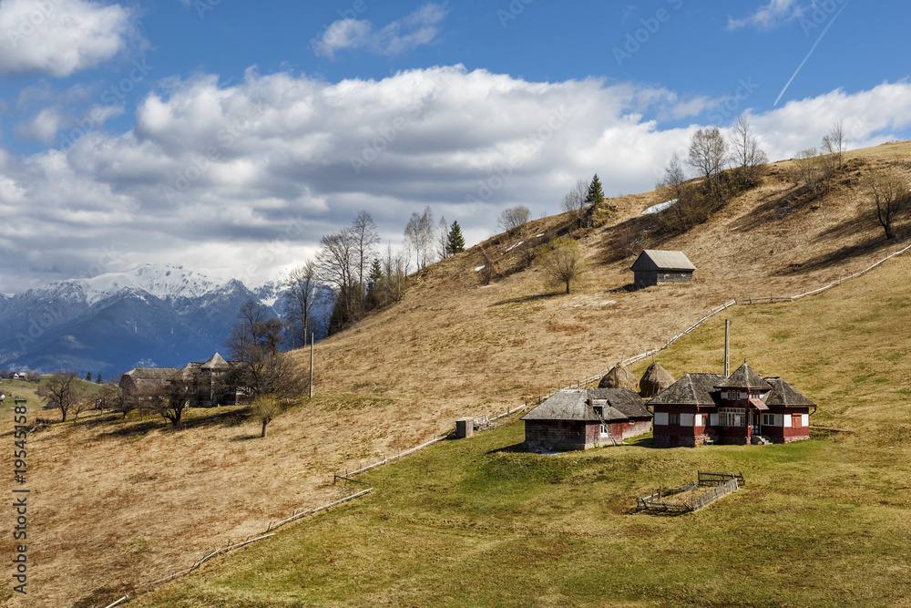 House on the top of the hill, snowy mountain background, House on the top of the hill, snowy mountain background,