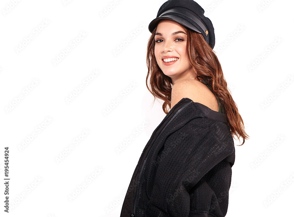 Portrait of young stylish laughing girl model in black casual summer clothes in cap with natural makeup isolated on white background. Looking at camera Portrait of young stylish laughing girl model in black casual summer clothes in cap with natural makeup isolated on white background. Looking at camera