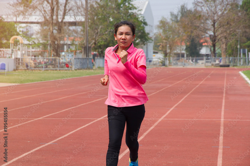 Asian lady run in track