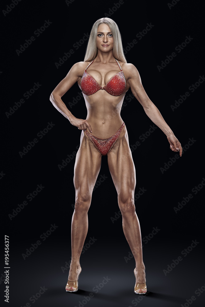 Image concept attractive woman winner fitness bikini model competition  Confident looking forward smiling Well training slim body perfect physique  shape Bodybuilder on black background Stock Photo | Adobe Stock