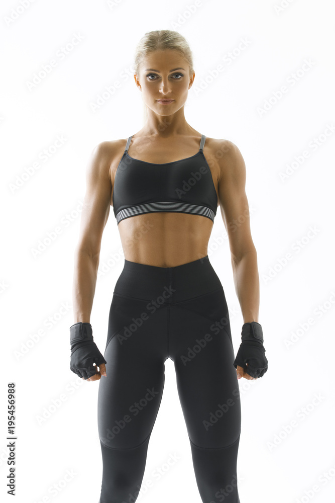 Healthy fit strong young woman in sportswear standing confidently looking  at front Strong and powerful concept Mockup Stock Photo | Adobe Stock