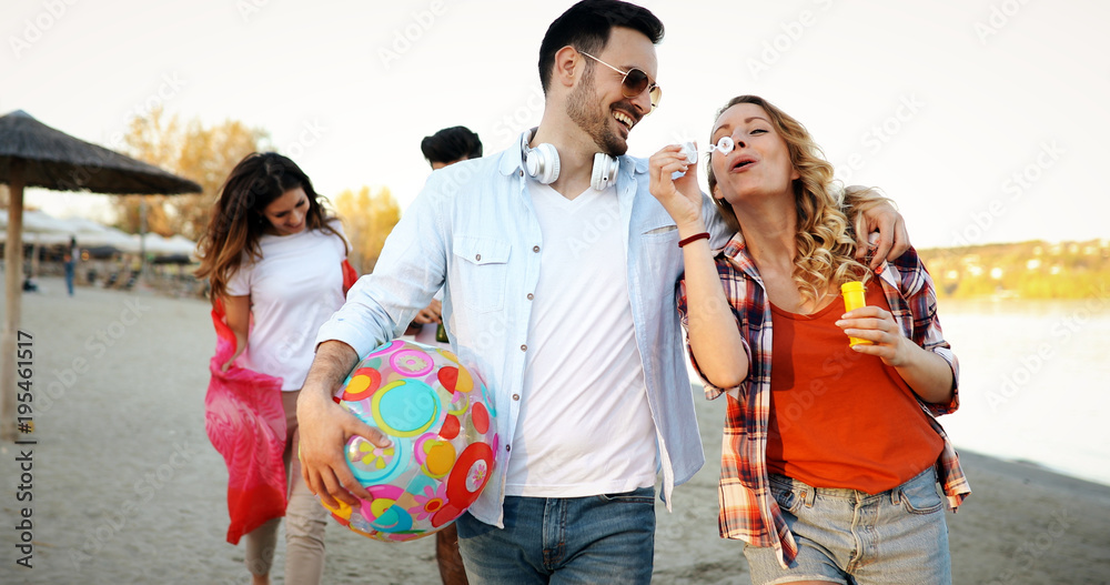 Fototapeta premium Group of young cheerful people bonding to each other and smiling