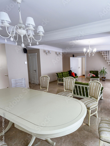 Dining room interior white colors. Wide angle spacious contemporary interior ...