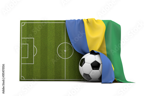 Gabon country flag draped over a football soccer pitch and ball. 3D Rendering © ink drop