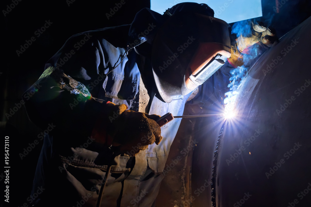 The welder is gaining increased cladding weld The welder is gaining increased cladding weld