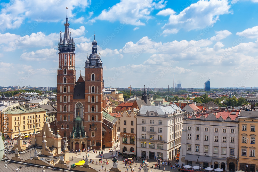 Naklejka premium .View of the mariacki church and the roof of the building sukiennice from the height of the town hall building in the Polish city of Krakow.