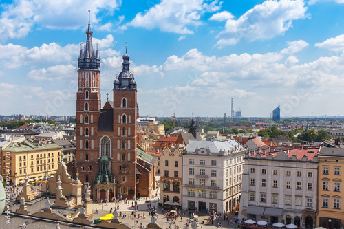 .View of the mariacki church and the roof of the building sukiennice from the height of the town hall building in the Polish city of Krakow.