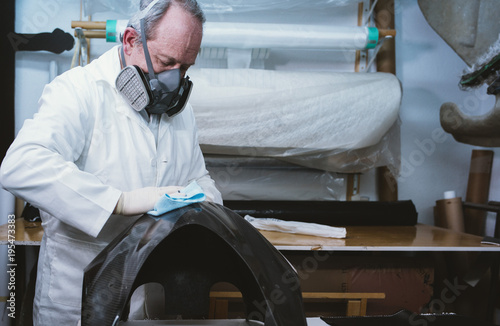  59  year  old man working at the fiber workshop photo