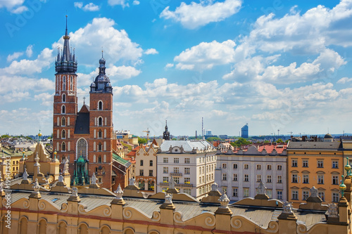 .View of the mariacki church and the roof of the building sukiennice from the height of the town hall building in the Polish city of Krakow. photo