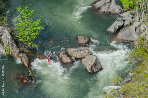 Two Kayaks in Rapids